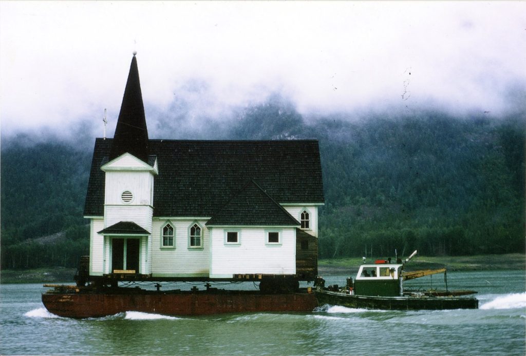 St. John's Church at Arrow Park East on a barge going to Nakusp, June 1967. /POSTED WITH PERMISSION FROM ARROW LAKES HISTORICAL SOCIETY, ETY2006.019.4.9